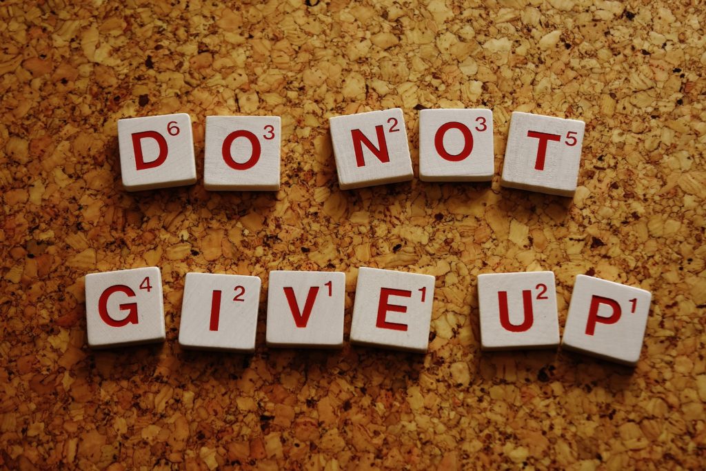 scrabble tiles saying Do Not Give Up
